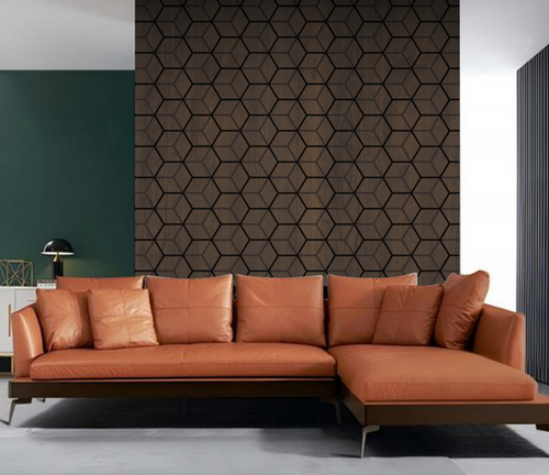 Orange sectional sofa in a modern living room with geometric acoustic wall panel.